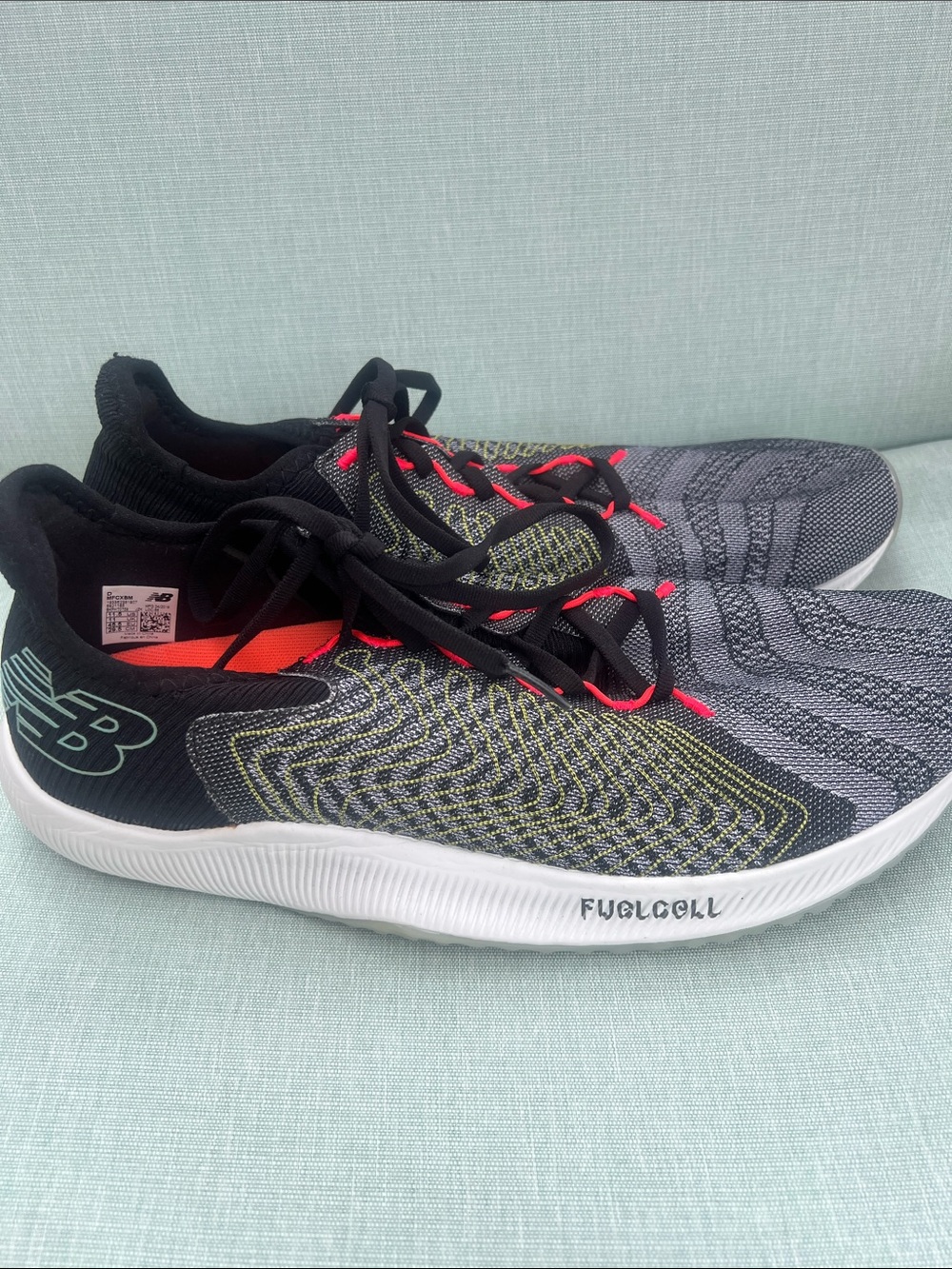 Like new New Balance Black Gray Athletic Shoes with Red Accents